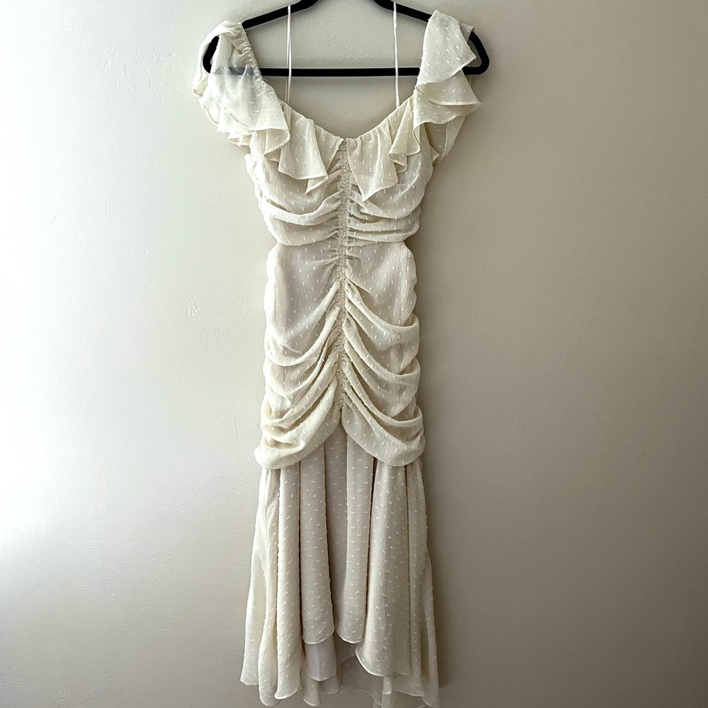 Whimsical white mermaid cut dress with side cutouts and lace